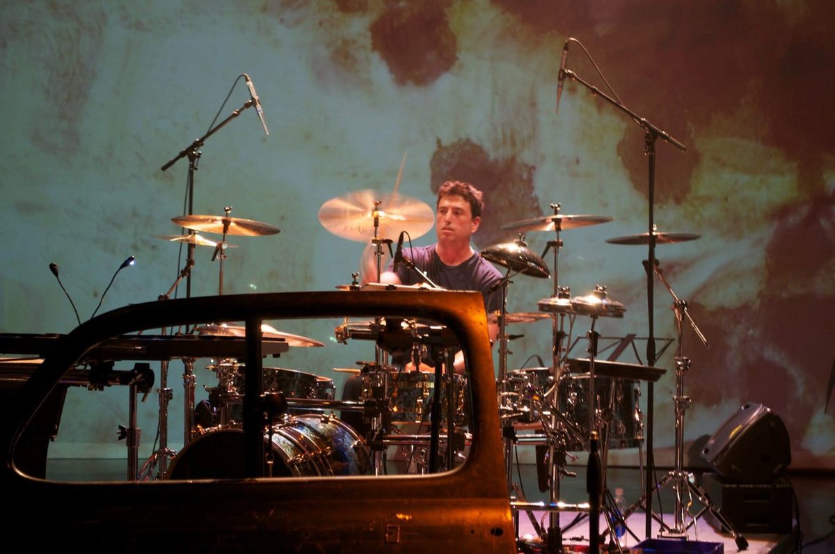Steve Joslin in silhouette at an electronic percussion rig